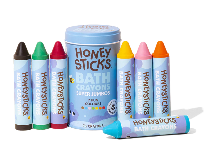 Honey Sticks bath crayons set with a blue tin on a white background