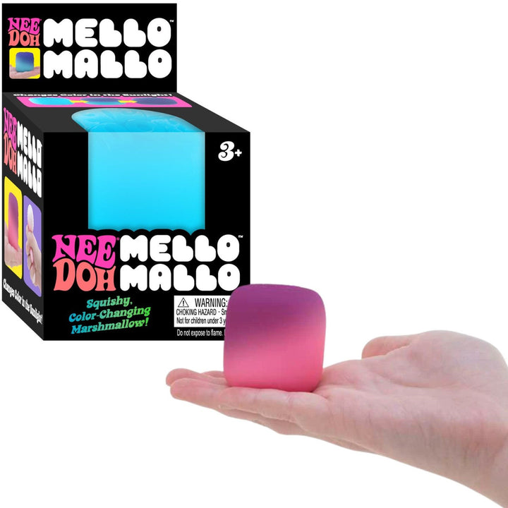 Color-changing marshmallow in front of its packaging with 'Nee Doh Mello Mallo' branding.