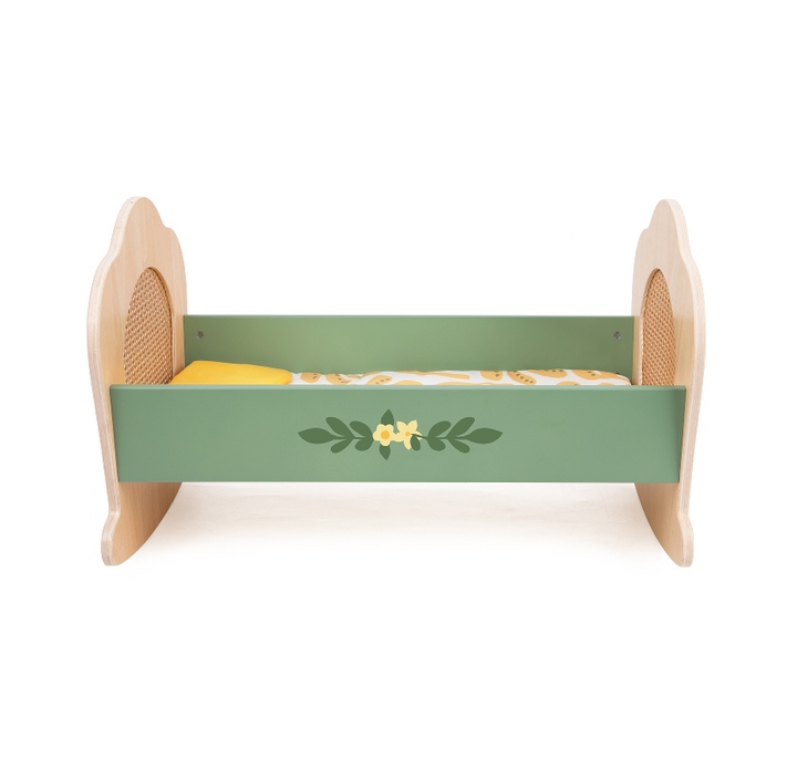 Green wooden rocking cot with floral design on a white background