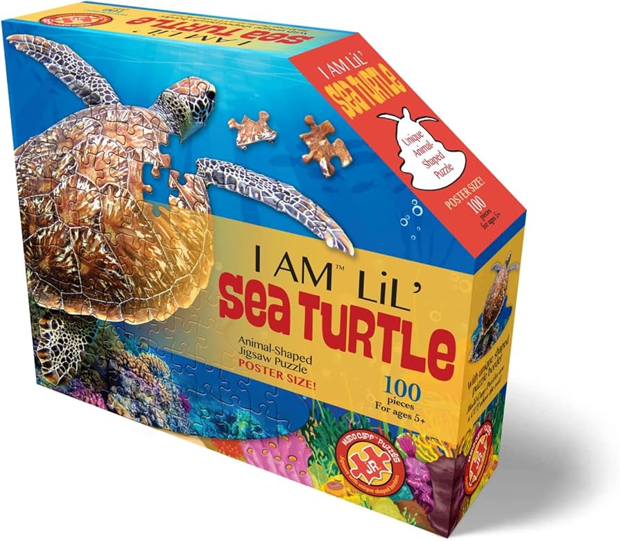 Box of 'I Am Lil' Sea Turtle' animal-shaped jigsaw puzzle, featuring a colorful illustration of a sea turtle on a blue ocean background with coral reef details and puzzle pieces.