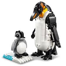 Two penguin figures from a building block set on a white background