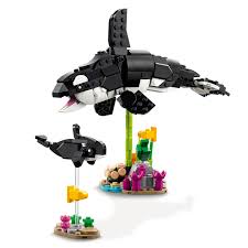 LEGO set with orca whales and coral reef on a white background