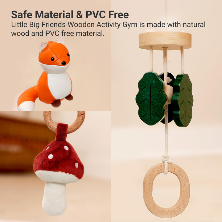 Wooden activity gym with fox toy, leaf-shaped rings, and mushroom-shaped ring on a beige background.