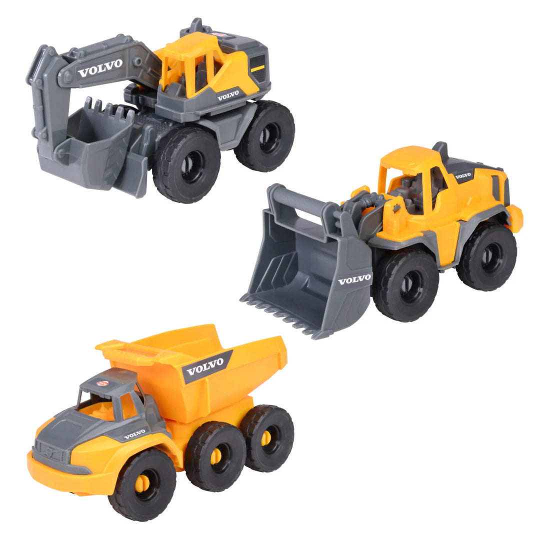 Three toy construction vehicles with Volvo branding on a white background