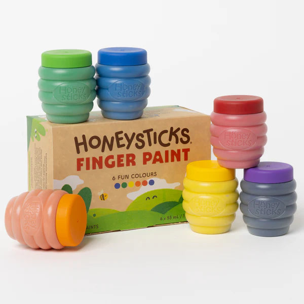 Set of colorful Honeysticks finger paint containers with a box in the background.