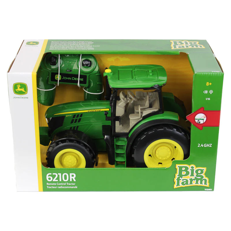 Toy tractor in John Deere packaging on a white background