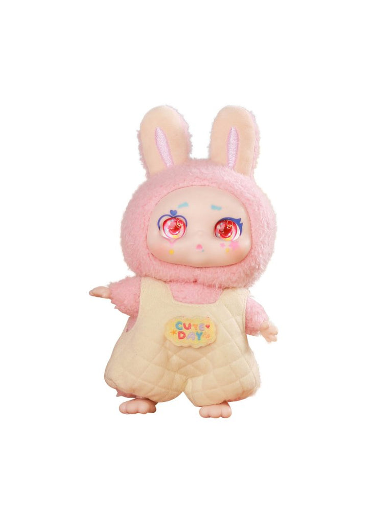 Toy figure with pink bunny ears and a yellow outfit on a white background