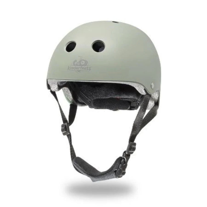 Green helmet with black straps on a white background