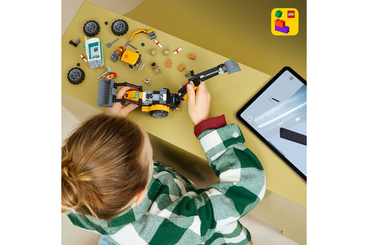 Child playing with LEGO  60480  on a table with a tablet beside them, featuring the LEGO logo.