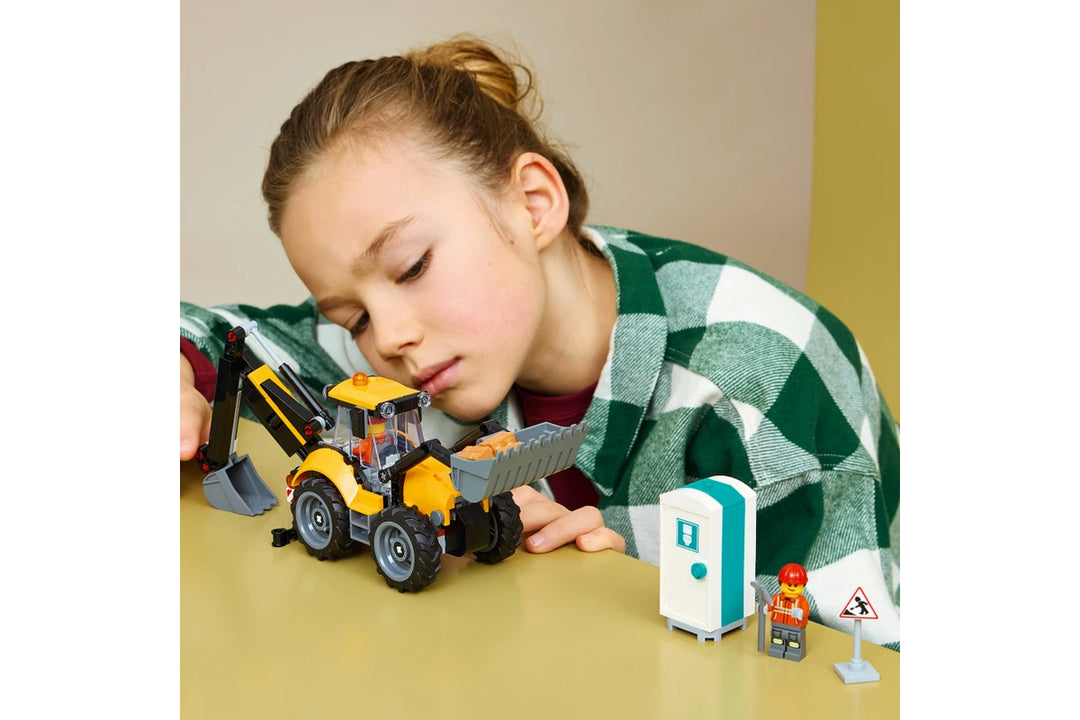 Child playing with a toy construction set on a table