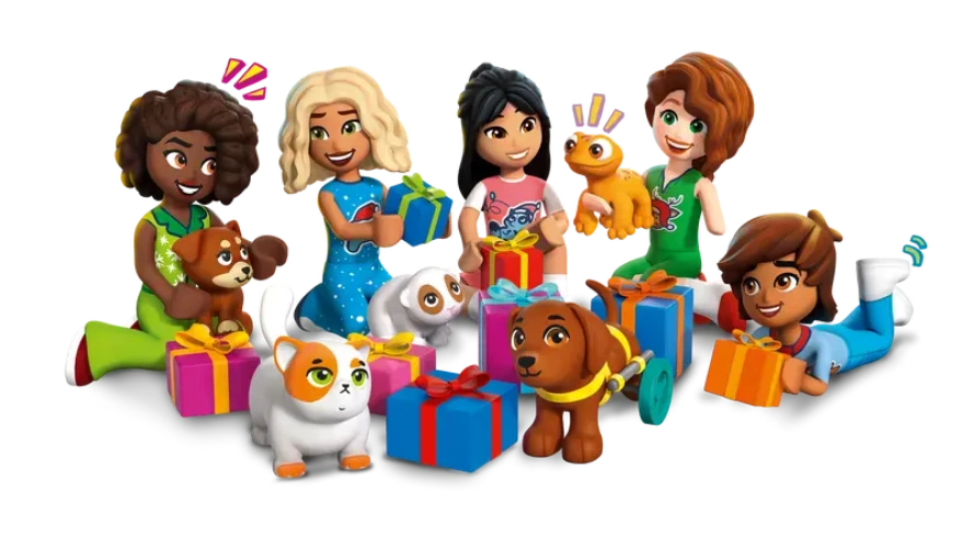 Toy mini figures of children and animals with presents on a white background