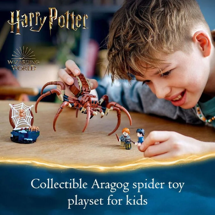Child playing with a Harry Potter Aragog spider toy playset on a wooden surface.