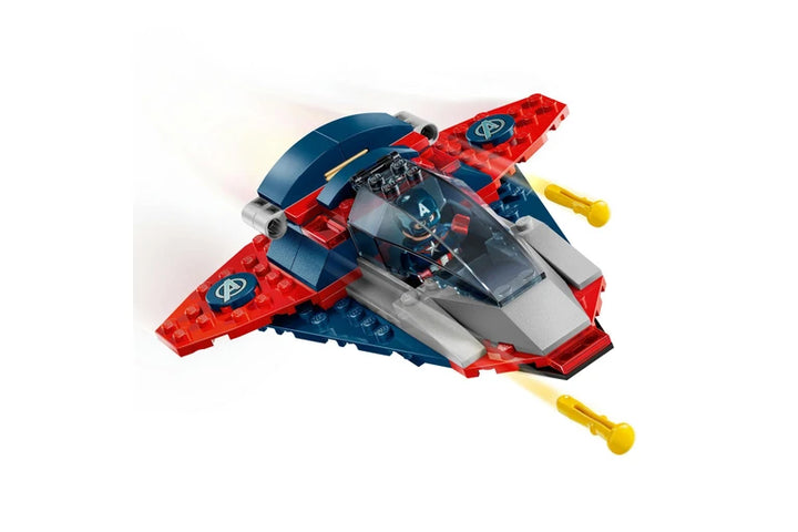 Toy spaceship model with red and blue colors on a white background