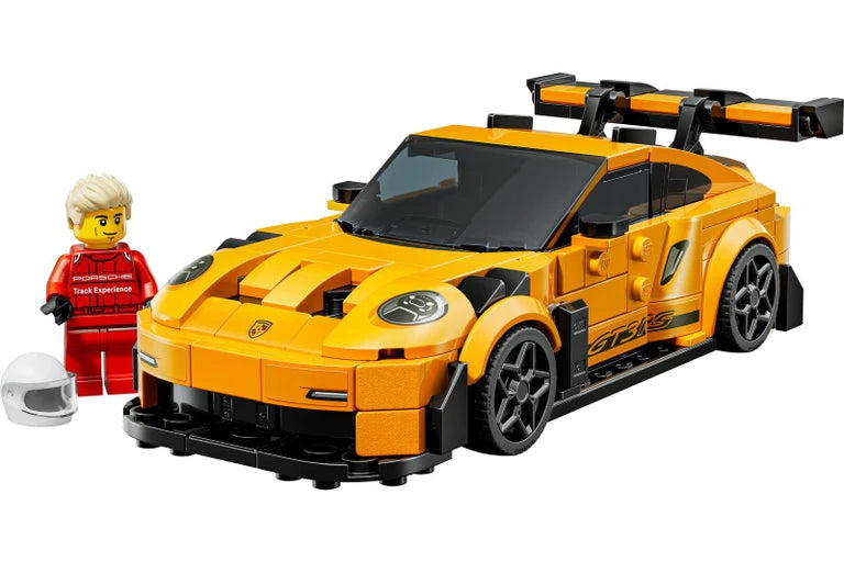 lego porsche Yellow sports car model built with interlocking bricks and a small figure next to it on a white background