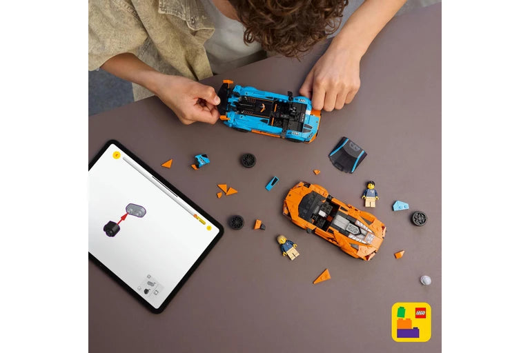 Children playing with LEGO vehicles and a tablet on a table, with LEGO logo visible.
