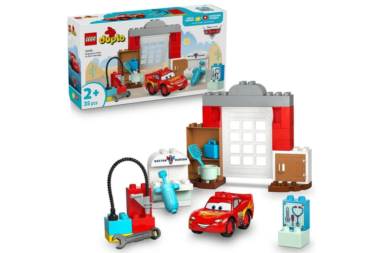 LEGO Duplo toy set with building blocks, cars, and a box on a white background