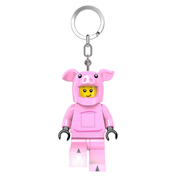 Keychain in the shape of a LEGO figure minifigure wearing a pink pig costume on a white background