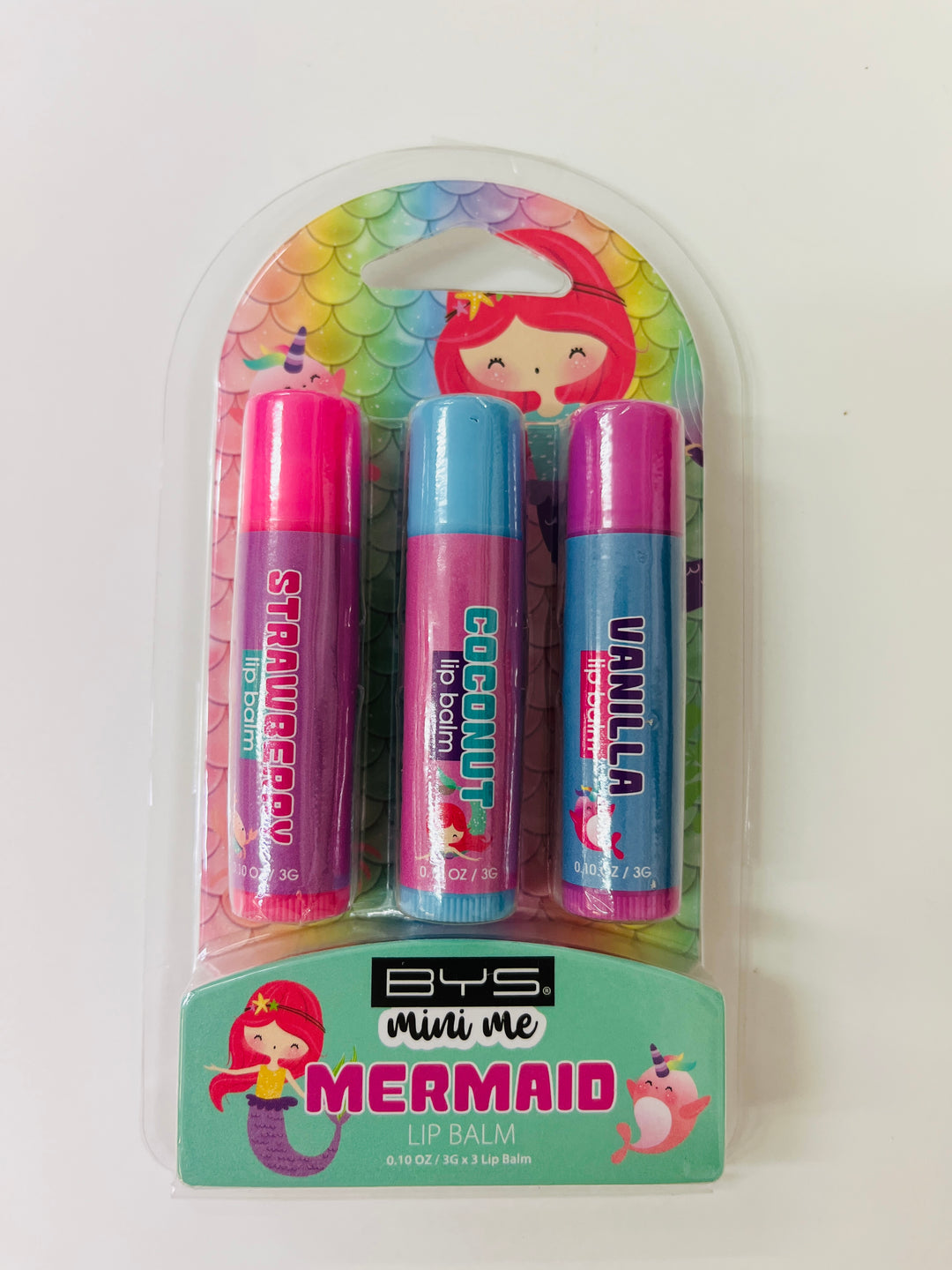 Packaged lip balms with mermaid design on a white background