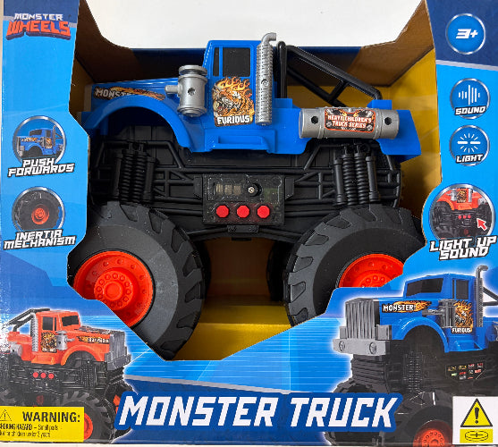 Blue and black monster truck toy in its original retail packaging, featuring a blue cab, black body, and red wheels with printed product features on the box.