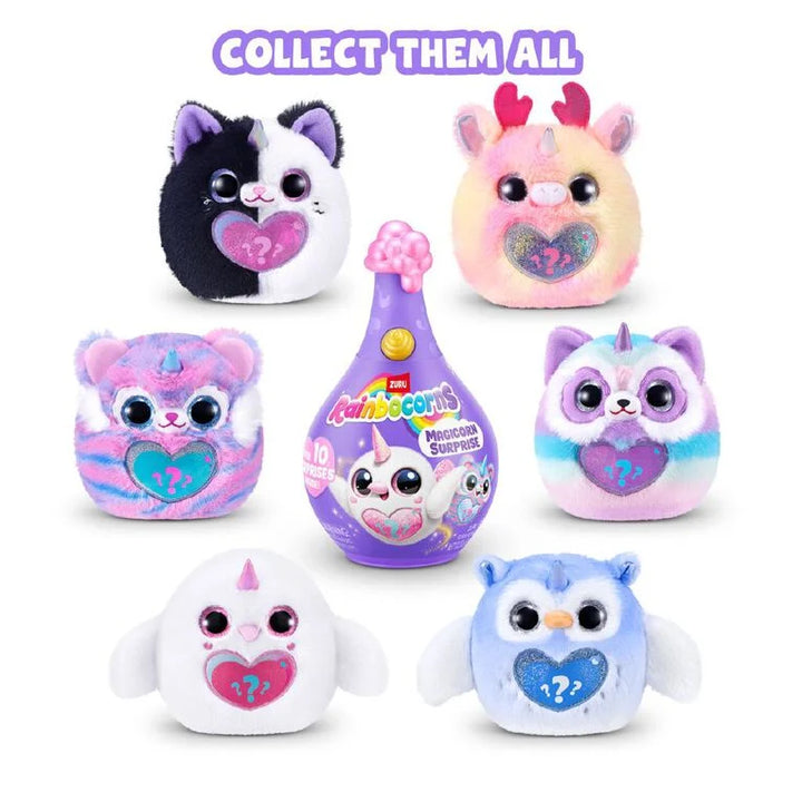 A set of Rainbow Babies collectible plush toys and a toy capsule on a white background, with the text 'COLLECT THEM ALL' at the top. The collection includes a black-and-white cat, a pink-and-peach hamster, a pink-and-purple hamster, a pastel rainbow cat, a pastel rainbow owl, a white bird, and a blue owl, all featuring heart-shaped faces with question marks.