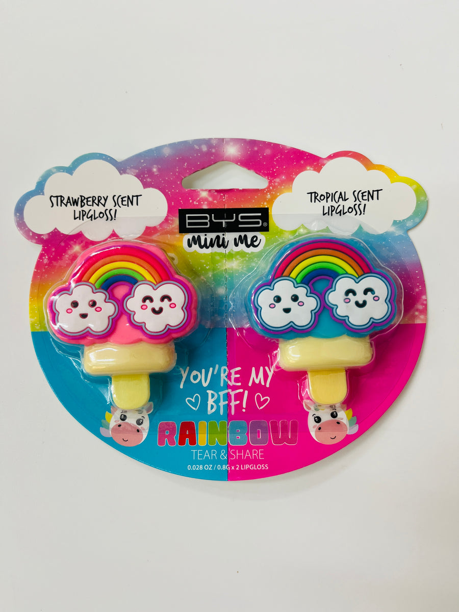 Two lip glosses with rainbow designs on a colorful packaging