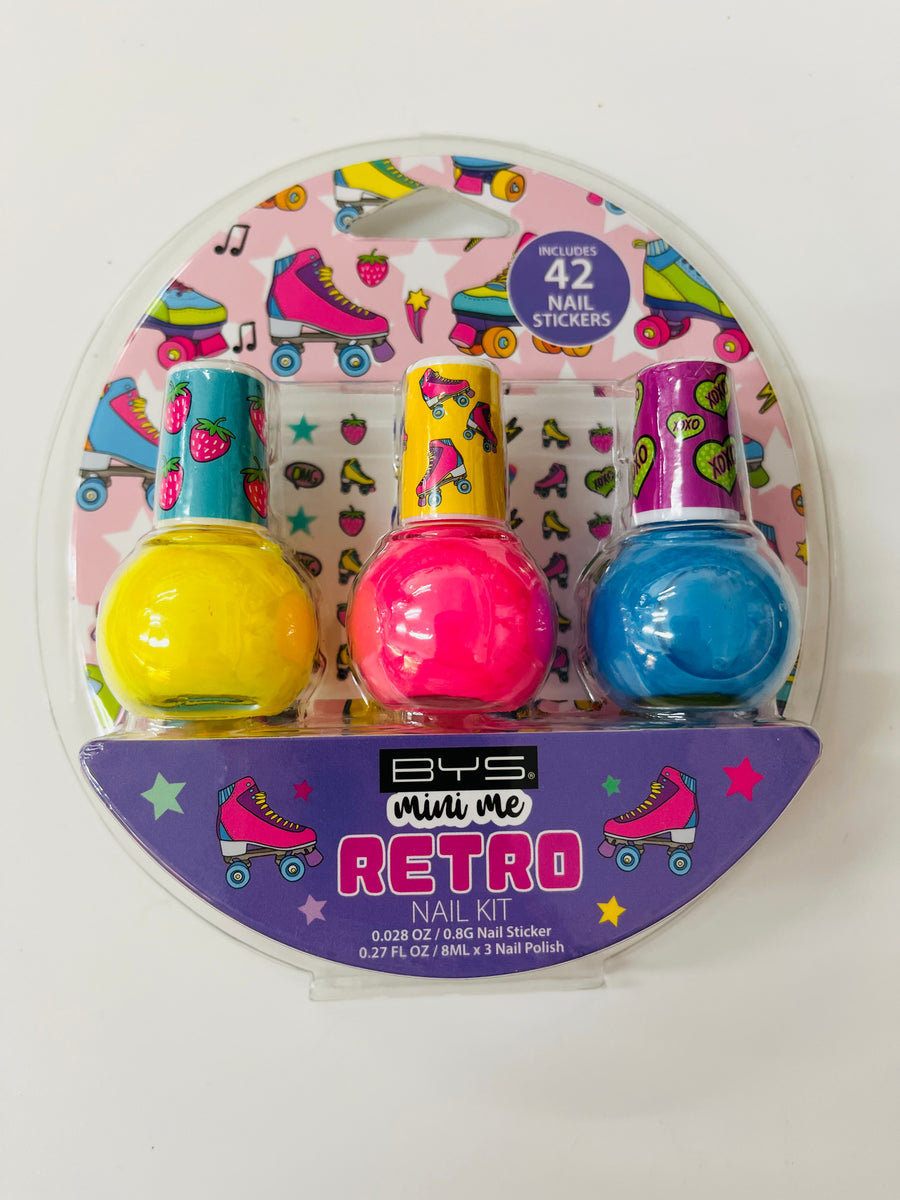 Packaged nail polish set with colorful bottles and roller skate design on a white background