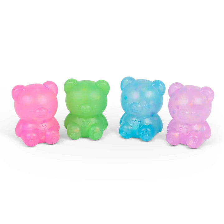 Four colorful squishy gummy bear toys on a white background