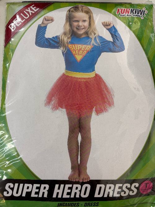 Superhero dress for children with Supergirl design on packaging