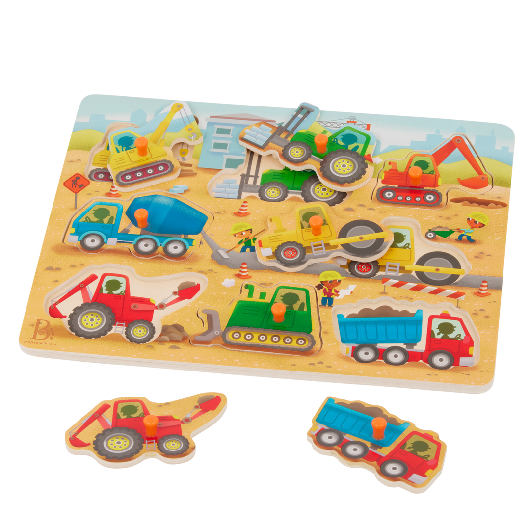 Children's puzzle with construction vehicle figures on a wooden board