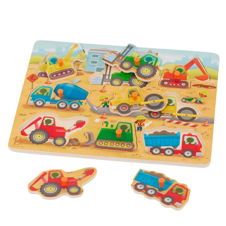 Children's puzzle with construction vehicle figures on a wooden board