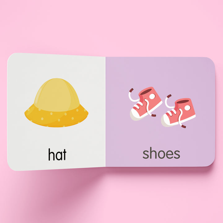Card with a yellow hat illustration on one side and pink shoes illustration on the other, on a pink background.