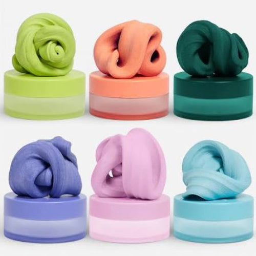 Set of colorful slime-like substances on cylindrical bases against a white background