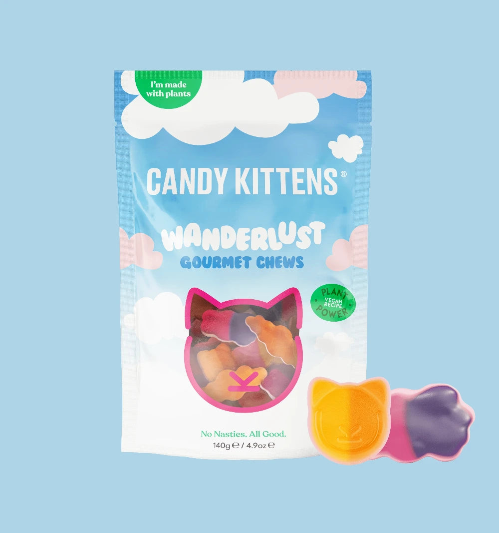 Packaging of Candy Kittens Wanderlust Gourmet Chews on a light blue background