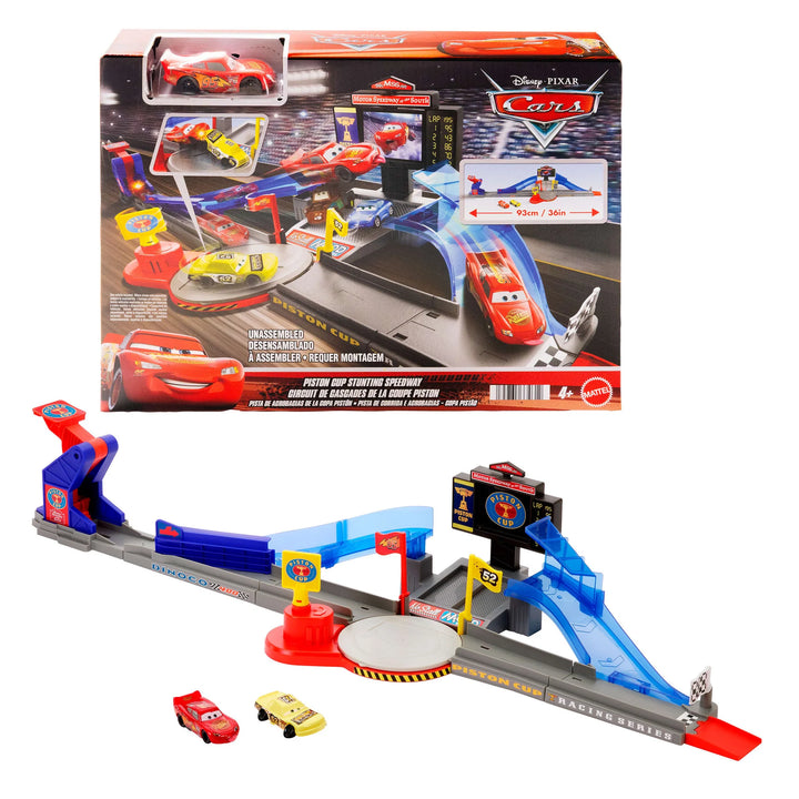 Toy race track set with cars and packaging featuring Disney Pixar Cars branding.