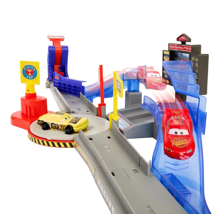 Toy race track set with two cars on a white background