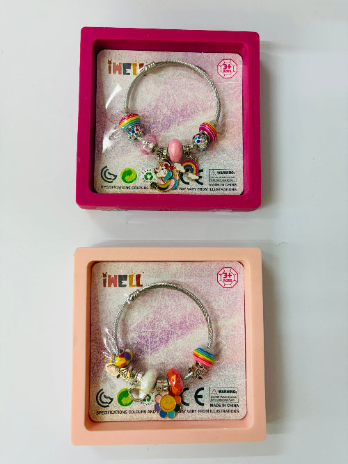 cute charm bracelet featuring two design unicorn or flower in a display box