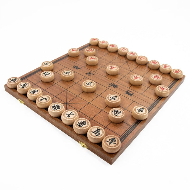 Chinese chess board display with 16 pieces on each side on a white background