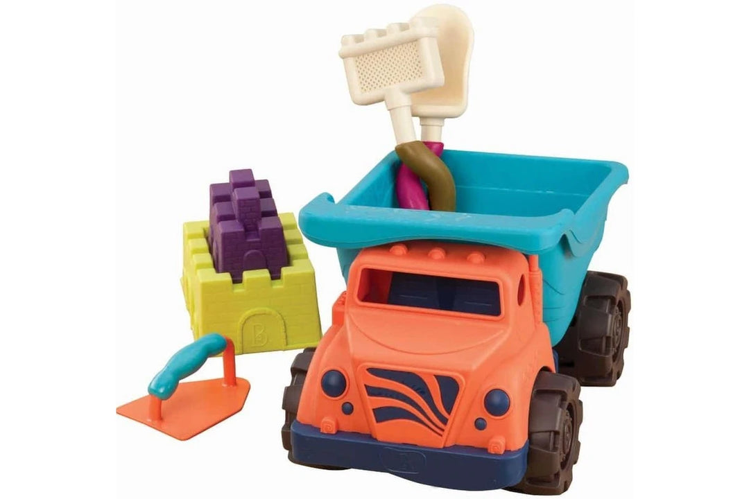 Colorful toy sand truck with sand tools on a white background