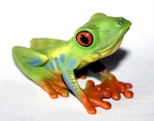 Colorful frog figurine on a white background
