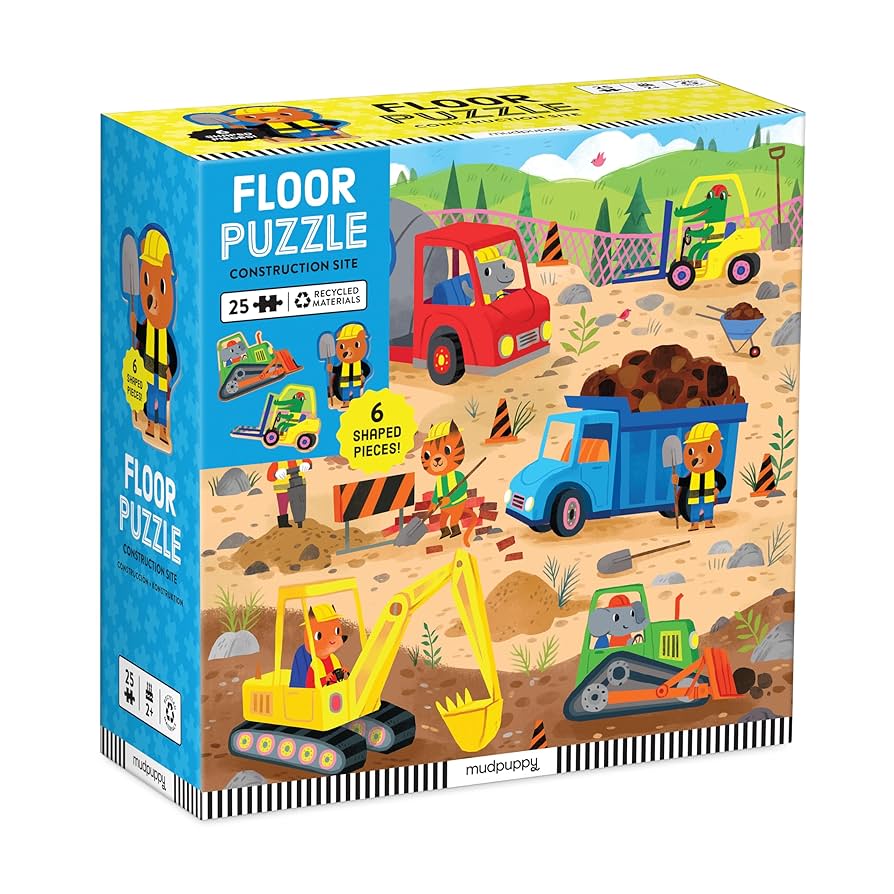 Box of a construction-themed floor puzzle with colorful illustrations on a white background