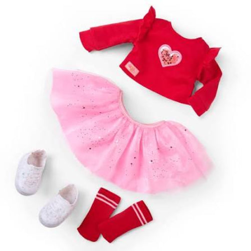 our generation doll clothes detached from doll body and laid out on white background