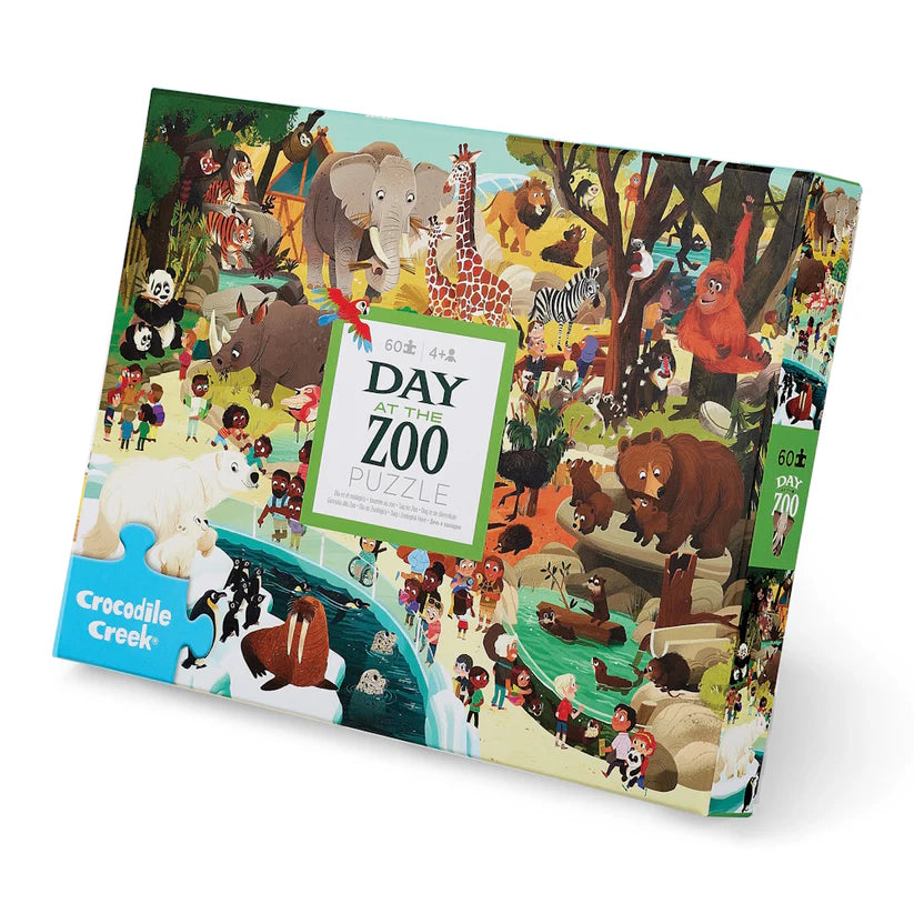 Puzzle box with colorful illustration of animals and children at the zoo, featuring Crocodile Creek branding.