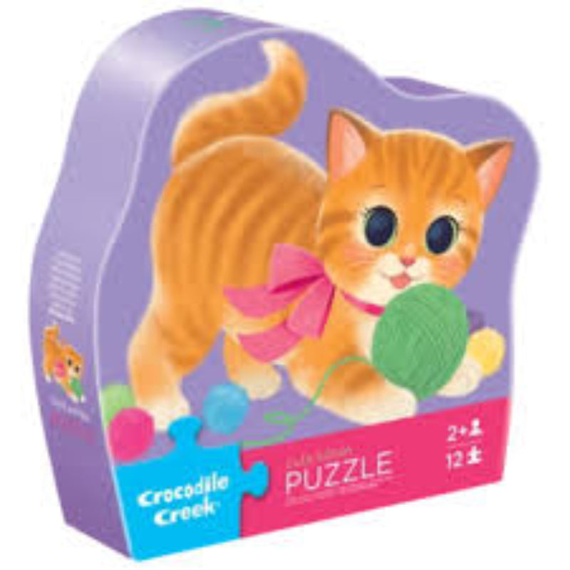 Puzzle box featuring a cat with a ball of yarn and a pink bow, branded as Crocodile Creek.