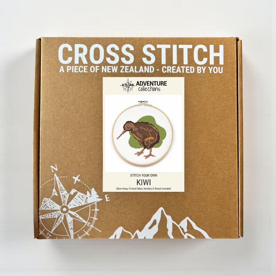 Cross stitch kit packaging with kiwi bird design on a cardboard box