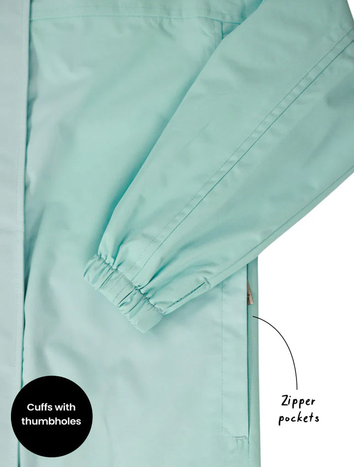Light blue jacket with cuffs and zipper pocket details on a white background