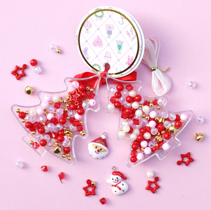 Christmas-themed beaded ornaments on a pink background