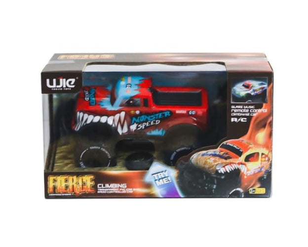 A boxed remote control monster truck toy on a plain white background. The package shows a red truck with blue and white graphics, large black wheels, and fiery orange graphics on the box art.