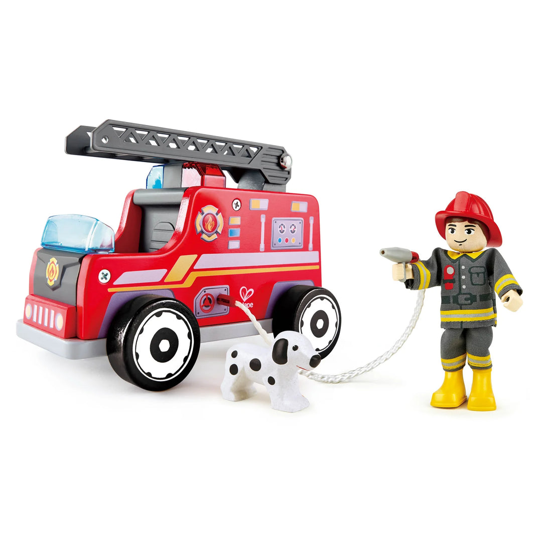Toy fire truck with ladder and firefighter figure on a white background