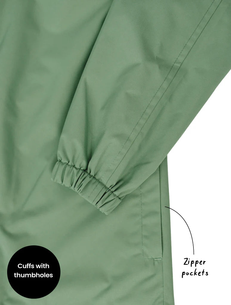 Green jacket with cuffs and thumbholes and zipper pockets on a white background