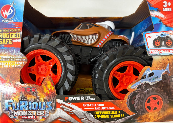 Furious Monster L16 SCUL off-road monster truck toy in its original retail packaging. The toy features a brown shark-mouthed body, large black knobby tires, and bright red wheels, with a blue and white shark graphic on the hood.
